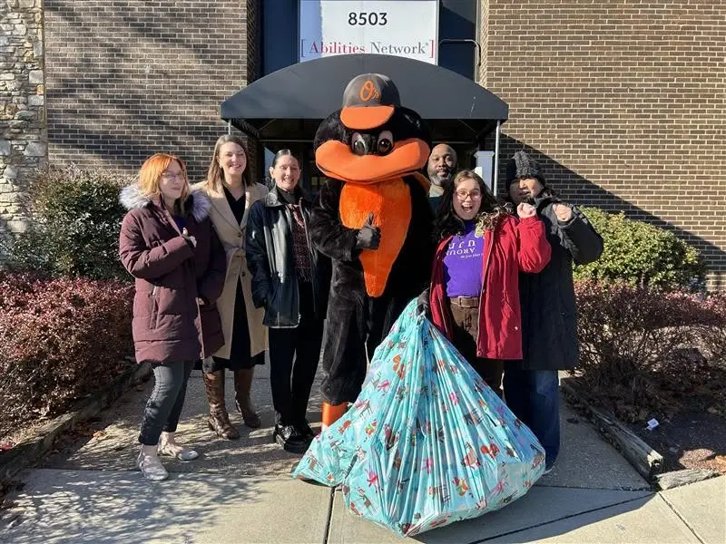 TurnAround staff with Orioles mascot and donations - Other Ways to Give - TurnAround